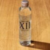 Mignonette Gin XII de Provence 10cl sur table en bois